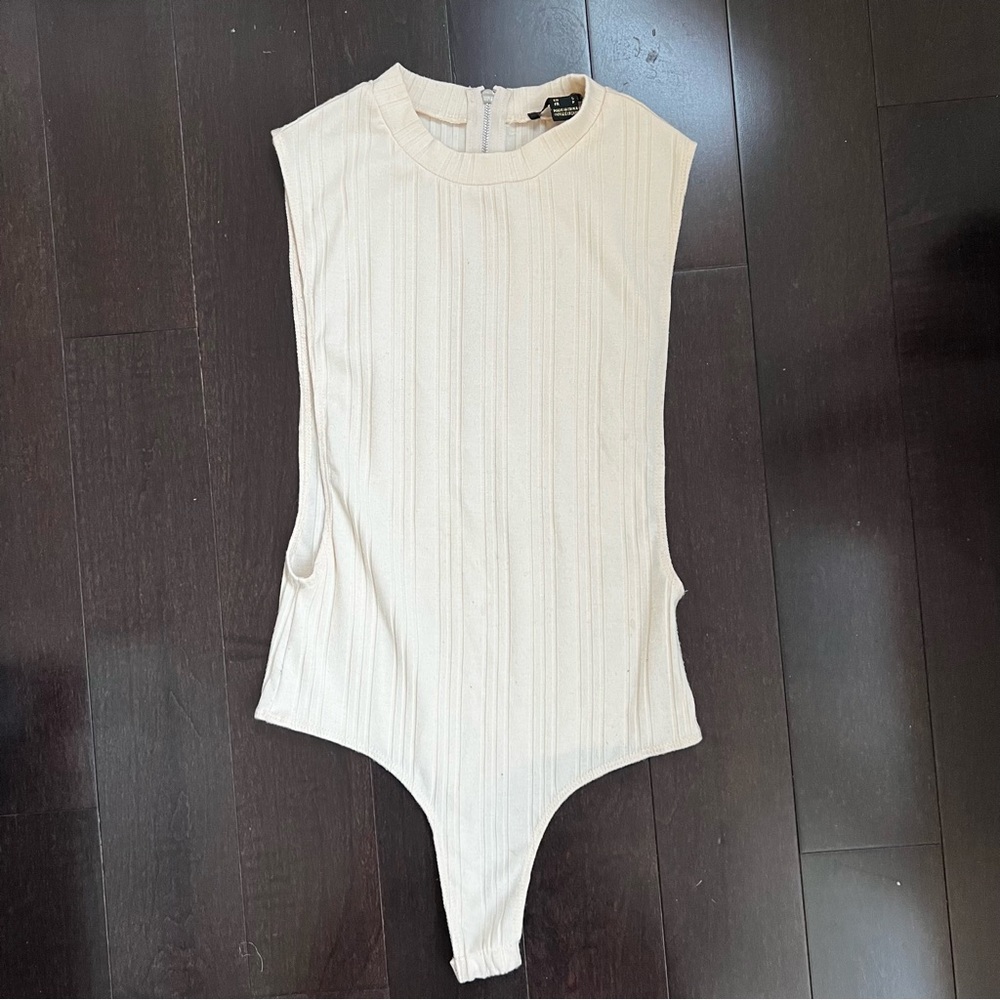 Cream coloured bodysuit size small perfect condition